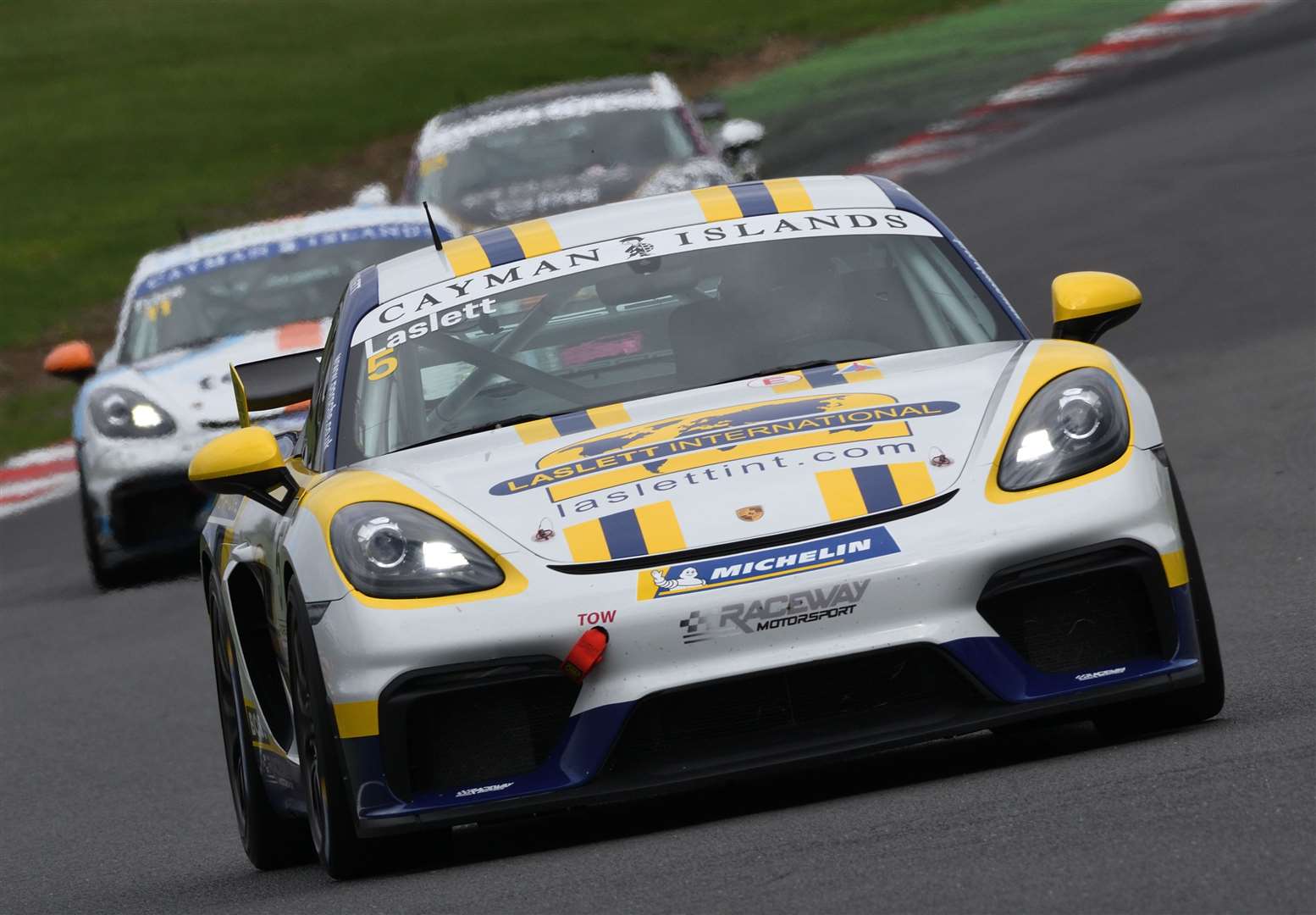 Rupert Laslett, from West Hythe, finished first and third, retiring in race two, in the supporting Sprint Challenge GB event racing his Porsche 718 Cayman GT4. Picture: Simon Hildrew