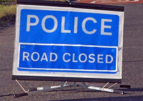 The road has been blocked after a car crashed into a barrier