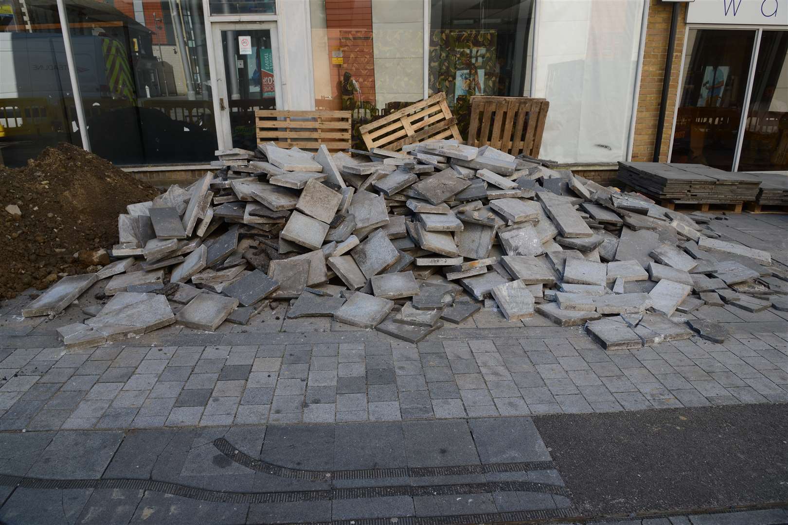 A pile of paving slabs have been ripped up to allow the Flume to be removed in Bank Street