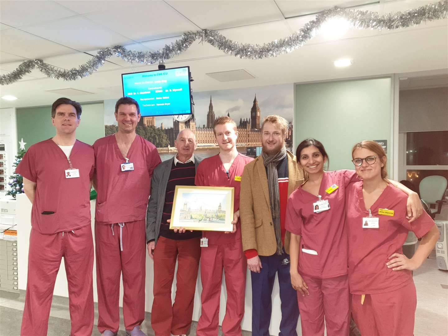 Jack Burnham and his dad Tom revisited staff at St Thomas' in December and presented a painting by Tom of the view from the ward window