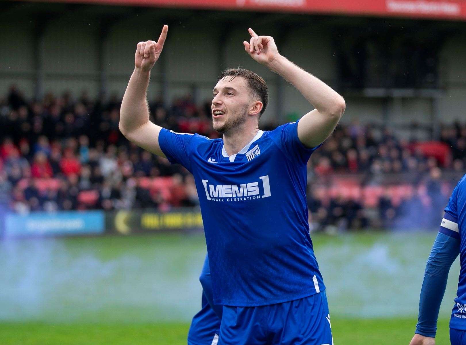 Conor Masterson celebrating Gillingham’s goal at Salford infront of the away fans
