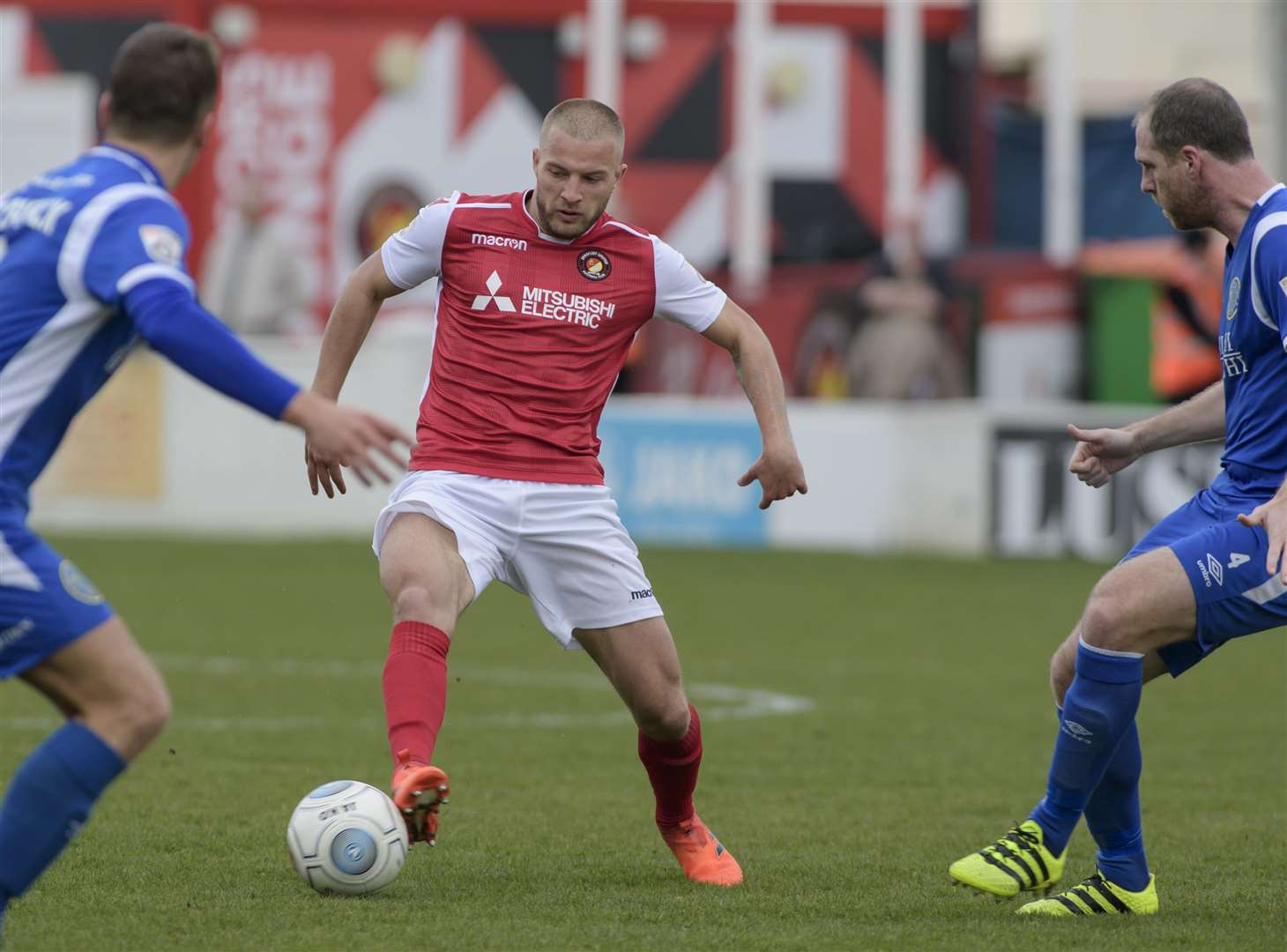 Luke Coulson takes on two Macclesfield players Picture: Andy Payton