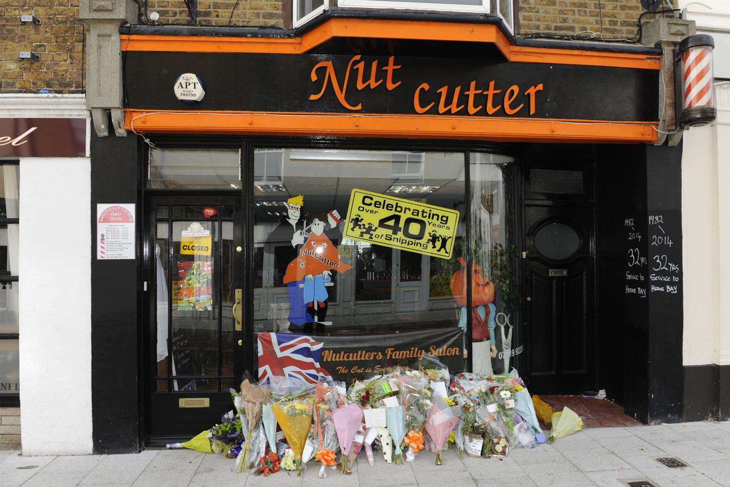 Flowers were left in tribute to Kevin outside the salon in Bank Street
