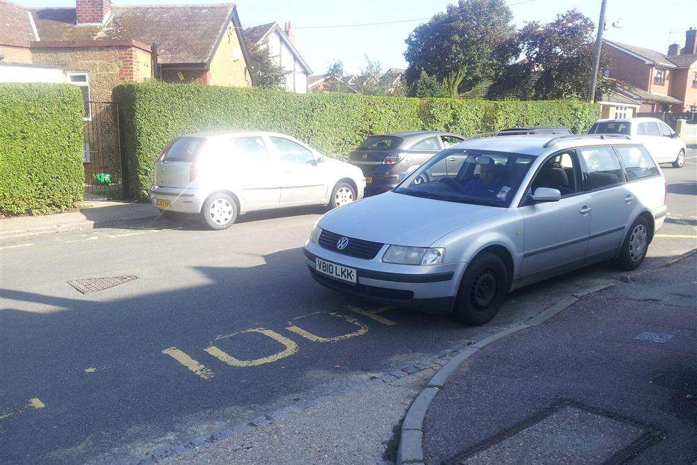 Cars parked on 'no parking' zig-zag lines outside Halfway Houses primary