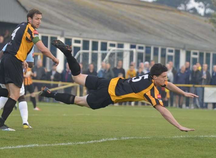 Frankie Chappell dives to head Folkestone in front Picture: Gary Browne