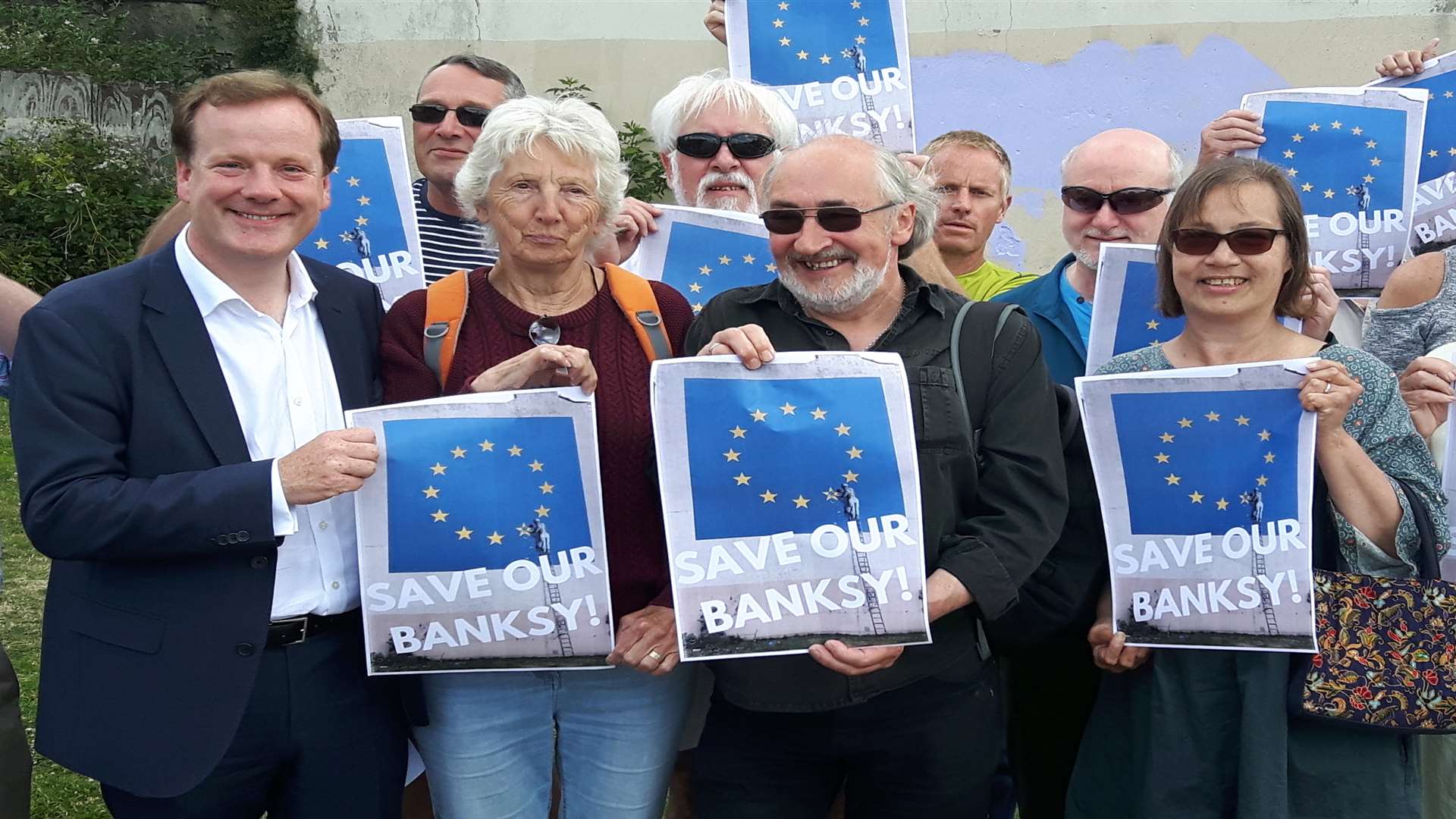 Charlie Elphicke in June with campaigners trying to keep Banksy work in Dover.