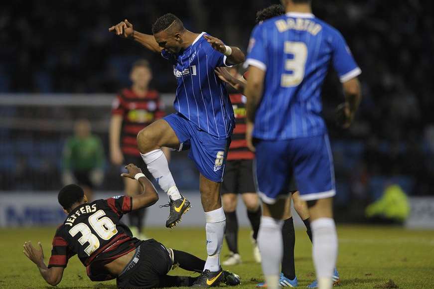 Gillingham defender Leon Legge is fouled by Shaun Jeffers. Picture: Barry Goodwin