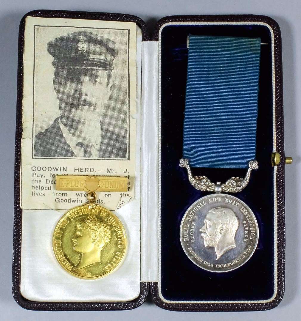 A rare early 20th Century US gold presidential medal presented by president Thomas Woodrow Wilson to James Pay, chief coxswain of the Kingsdown Lifeboat, and an RNLI silver medal awarded to Mr pay.