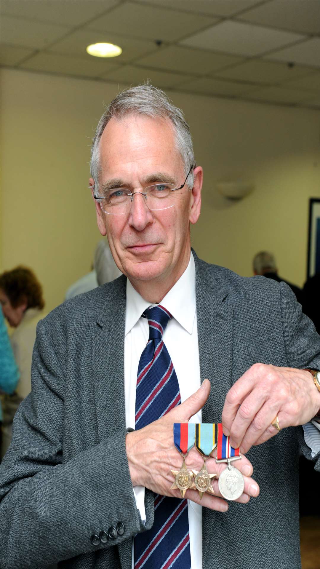 Chris Kerr with his uncle Gerald Kerr's medals, who served in the 610 squadron