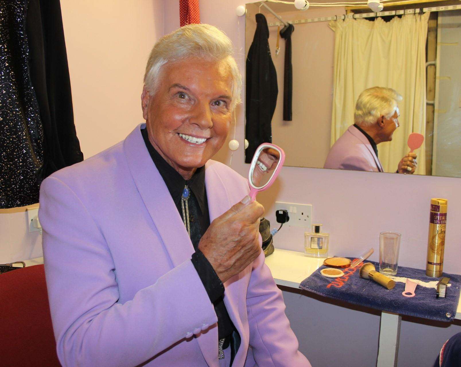 Jess Conrad checks his smile in a mirror backstage at the Criterion Theatre, Blue Town, on the Isle of Sheppey (3195085)