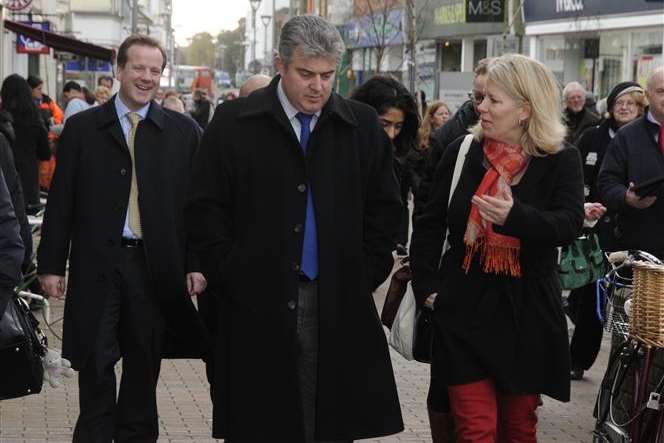 Esme Chilton of the Deal Town Team, right, takes Local Government minister Brandon Lewis MP on a tour of the high street after winning its award