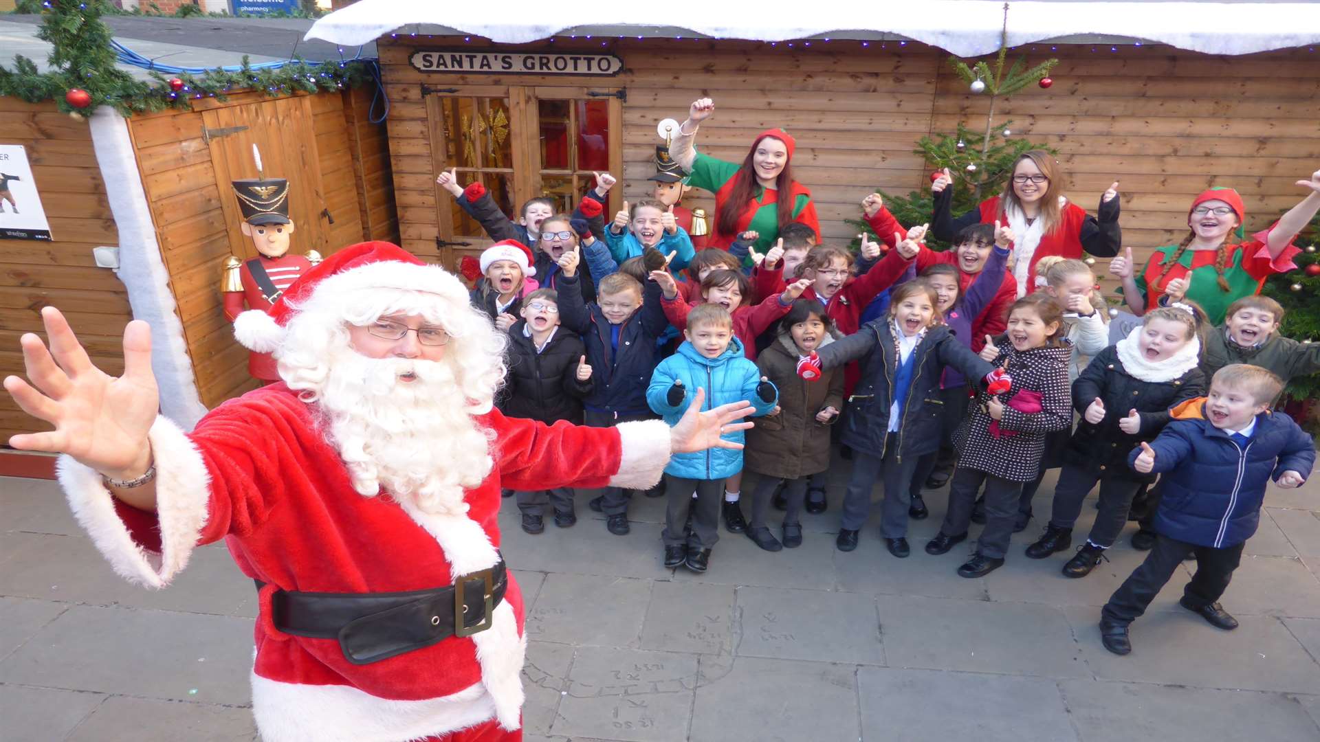 Class 3 of St Peter's Methodist Primary School collect their prize of a visit to Santa's grotto in Whitefriars after winning a walk to school challenge.