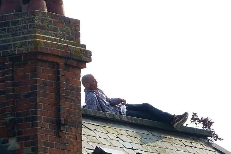 Beevor pictured on the roof. Picture: @Kent_999s