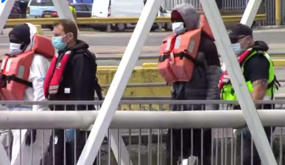 Asylum seekers walked up the gangway at Dover Western Docks in May. Picture courtesy of Chris Johnson