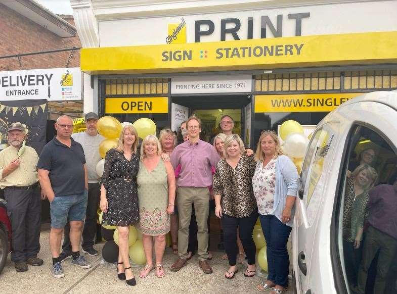 Staff from Singlewell Stationery and Print, including Simon pictured centre in the red, celebrate the firm's 50th birthday