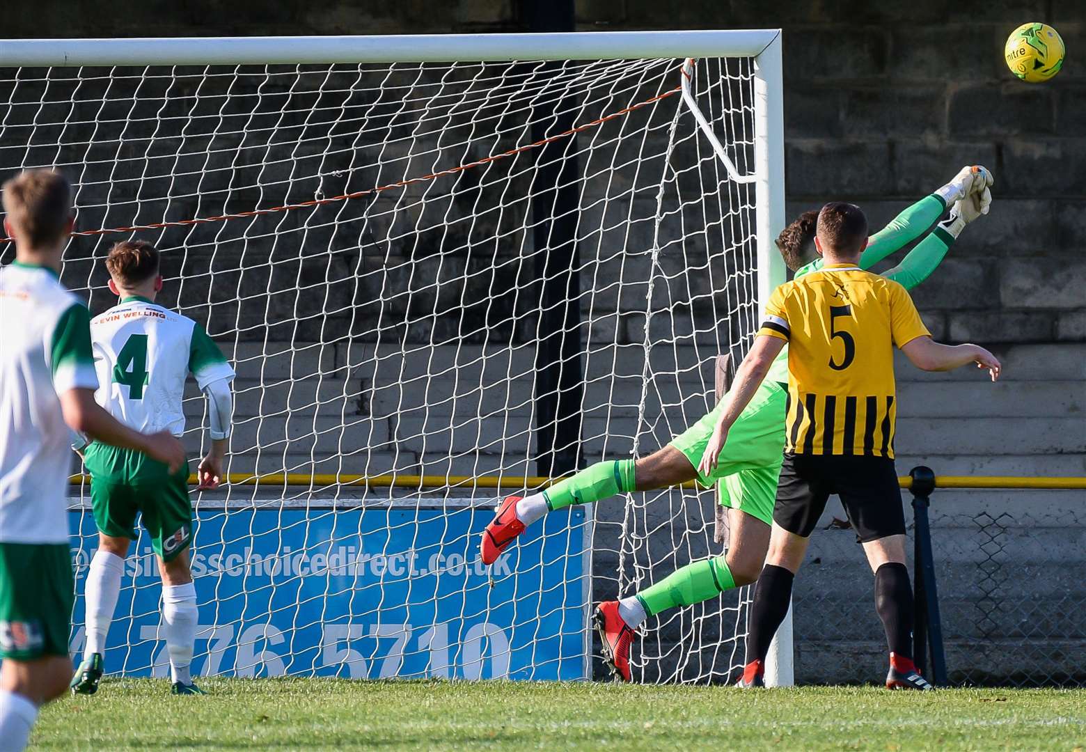 Folkestone Invicta keeper Henry Newcombe pulls off a save during Saturday's defeat to Bognor Picture: Alan Langley