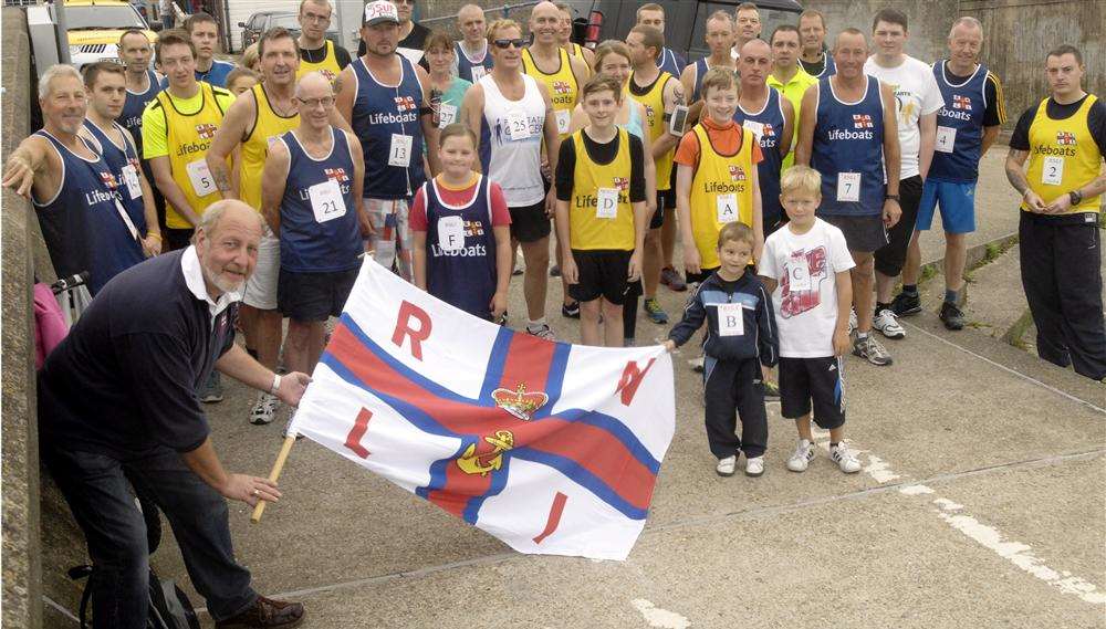 Coxswain/mechanic Robin Castle gets the runners underway for the Sheerness Lifeboat annual run Picture: Barry Crayford
