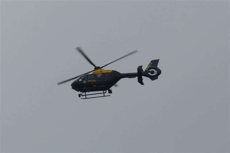 One of the two police helicopters spotted over Ashford town centre yesterday. Picture: Andy Clark