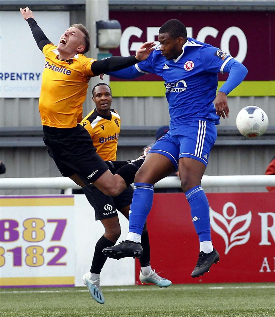 Maidstone United midfielder Sam Corne is sent flying against his old club Picture: Sean Aidan
