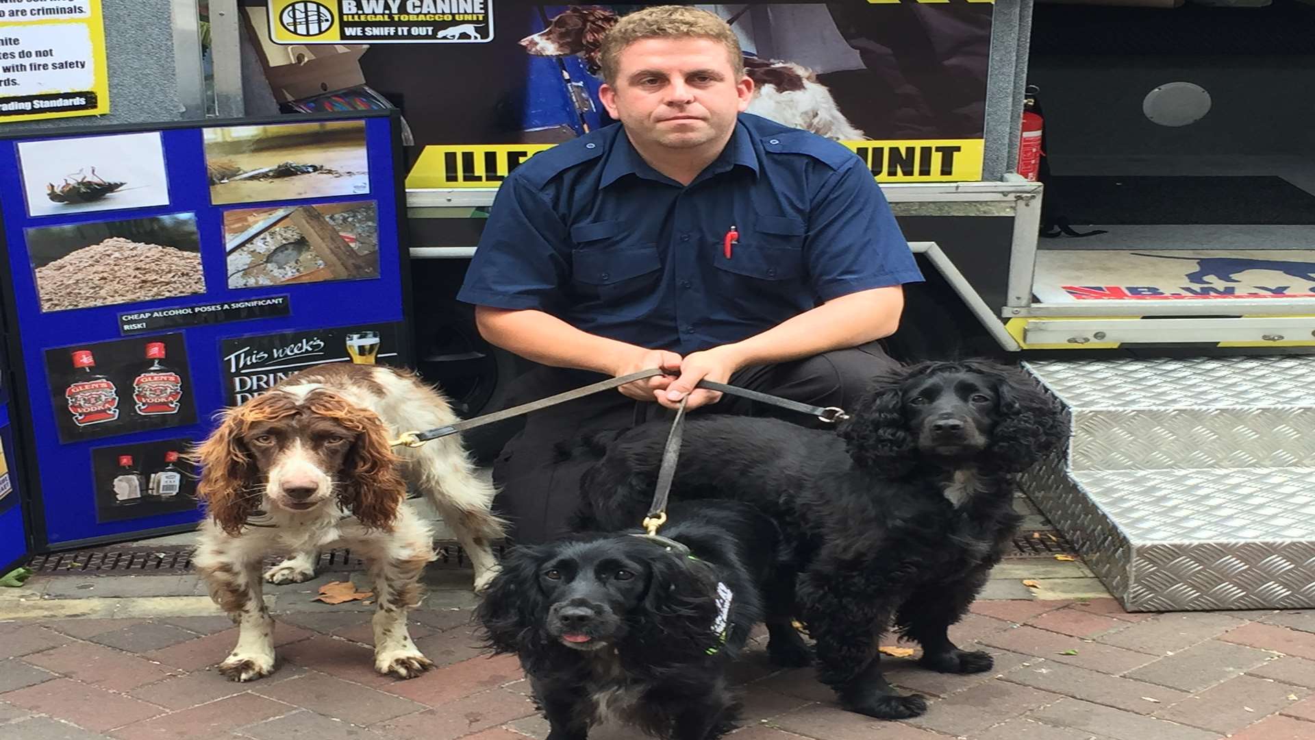 Dog handler Stuart Phillips, with Scamp, Phoebe, and Eric