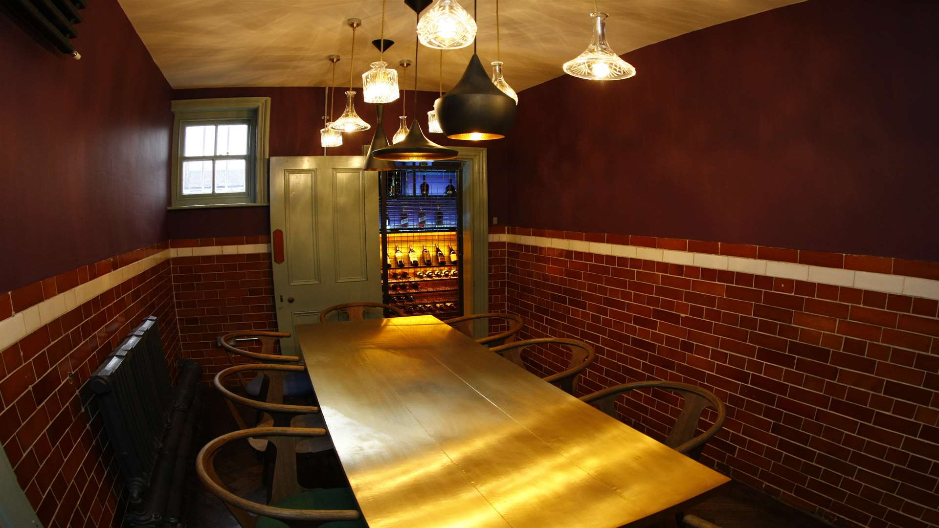One of the private dining rooms with a wine cellar