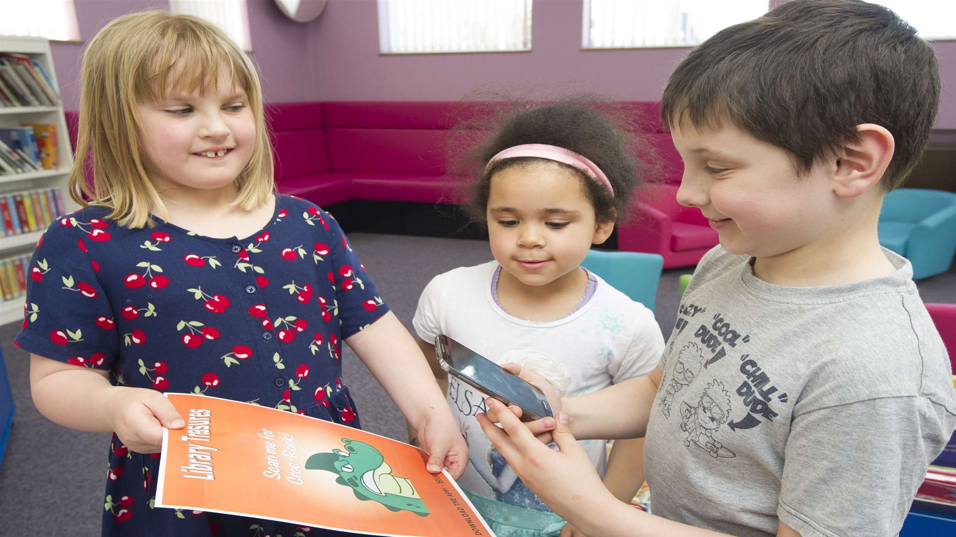 Olivia Robinson, 7, Faith Ukwubiwe, 5, and Callum Watts, 9, using the app