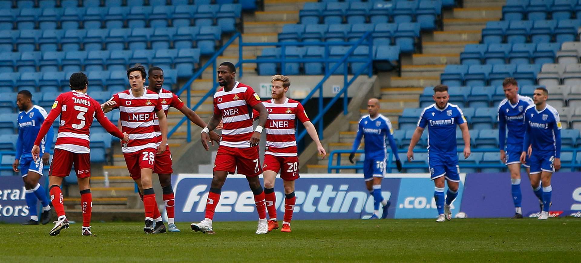 Contrasting emotions between the two teams as Doncaster make it 2-2 at Gillingham on Saturday. Picture: Andy Jones (45336095)