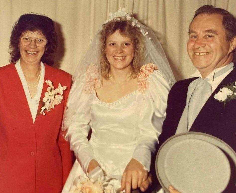Debbie Griggs with her parents Pat and Brian on her wedding day. Picture: Wendie Rowlinson