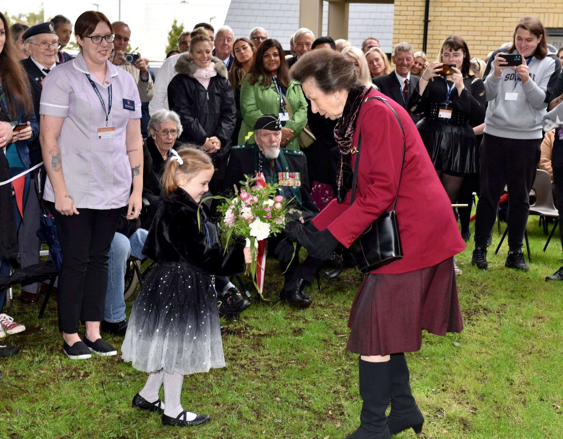 Lillith Budgen presents Princess Anne with a bouquet