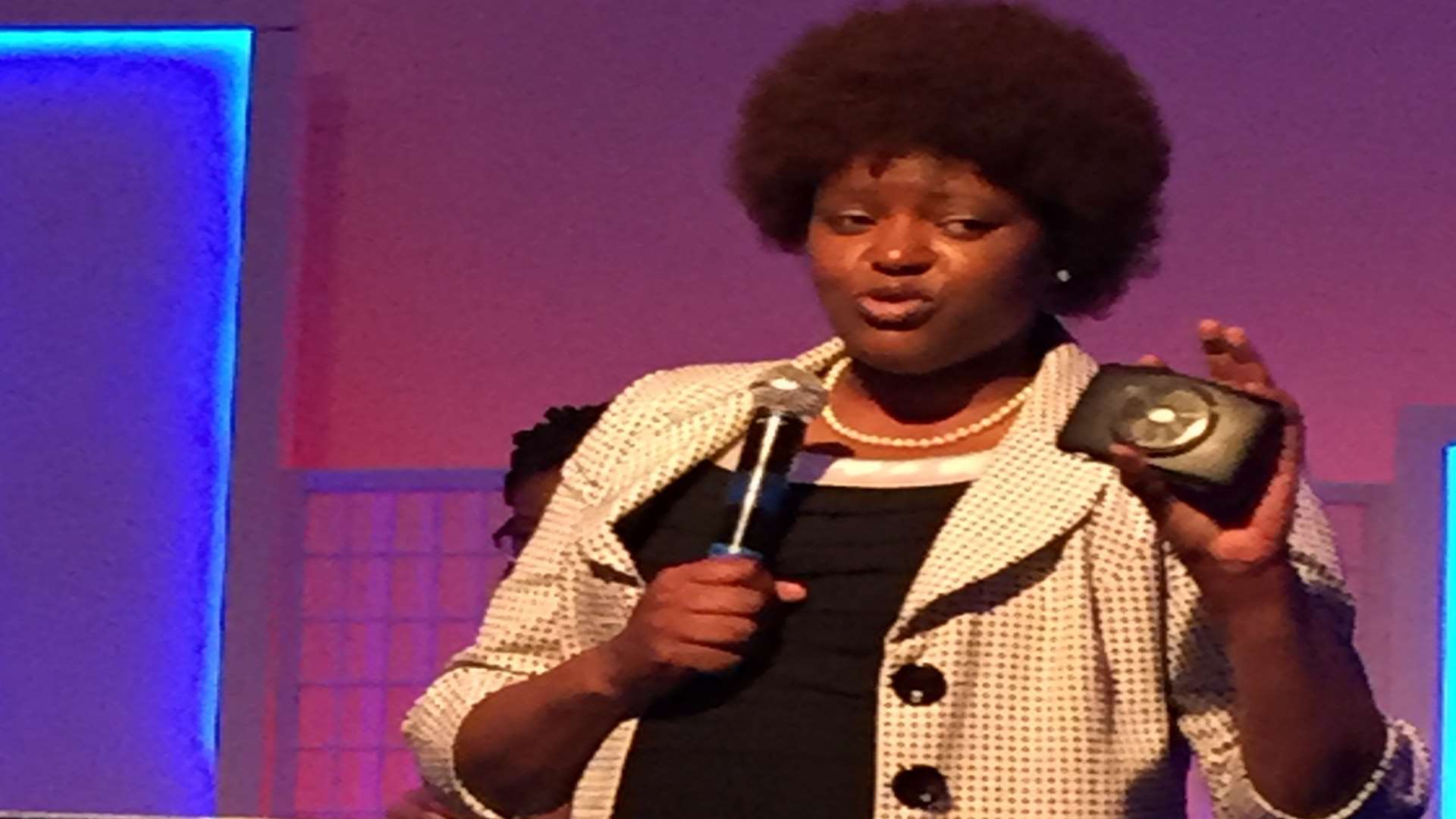 Mildred talking to the congregation at her church in Ashford