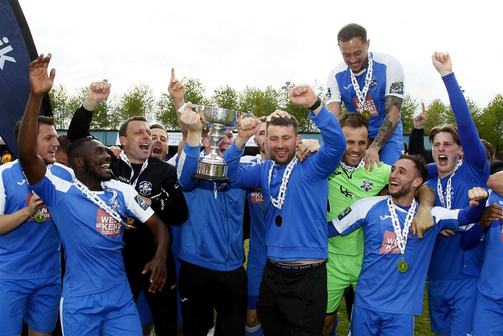 Sonny Miles gets his hands on the Bostik Premier play-off trophy Picture: Sean Aidan