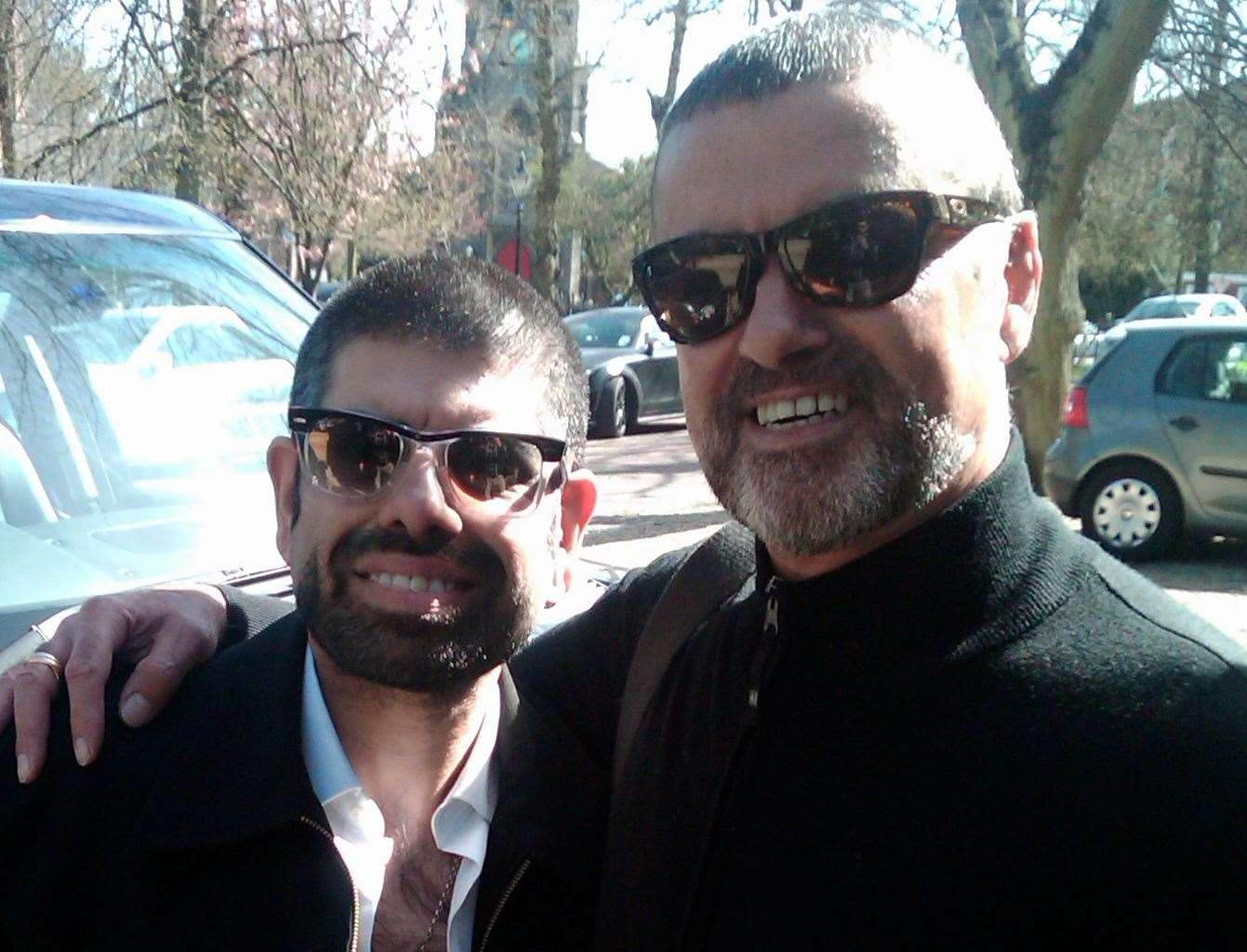 Saf Sathi, from Rochester, poses with his idol, George Michael