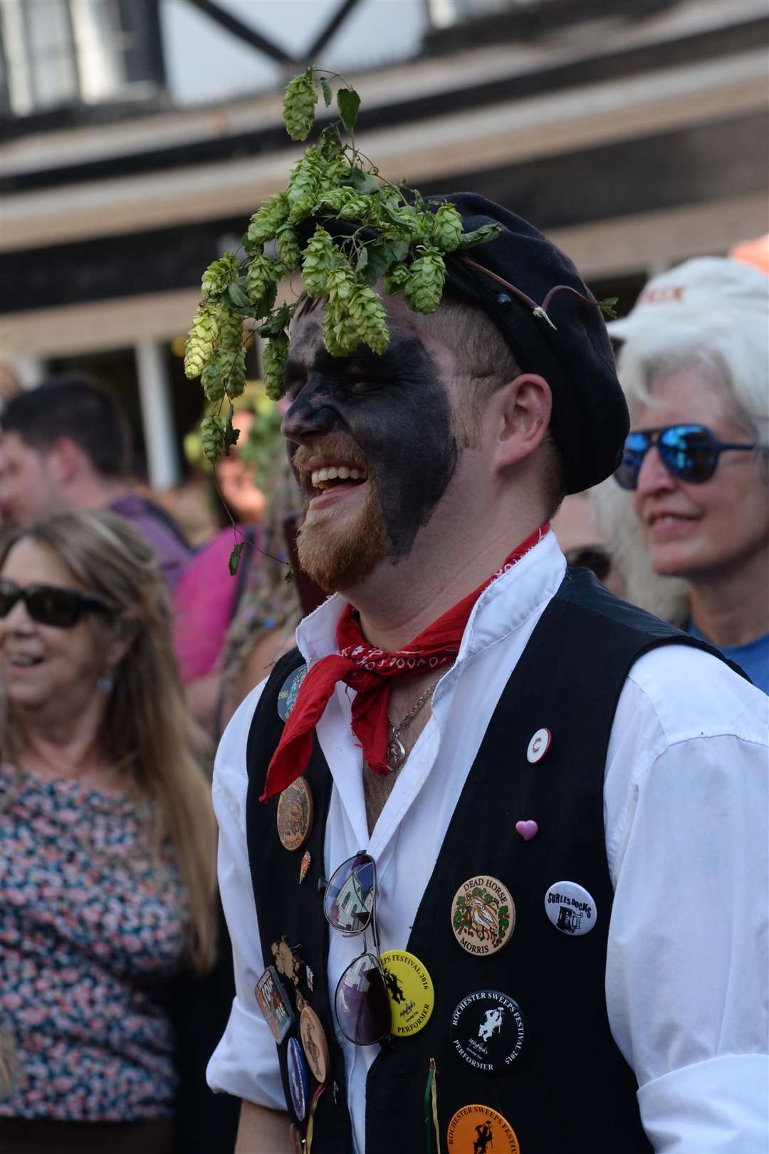 Stuart Shannon takes a break from morris dancing to watch Foot Down performing on the market place stage.