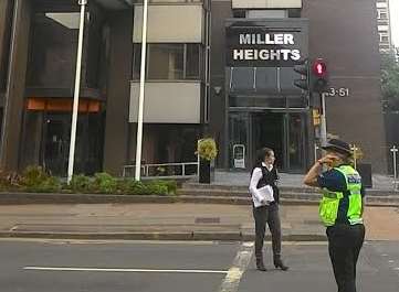 Police outside Miller Heights, which has recently been converted into flats