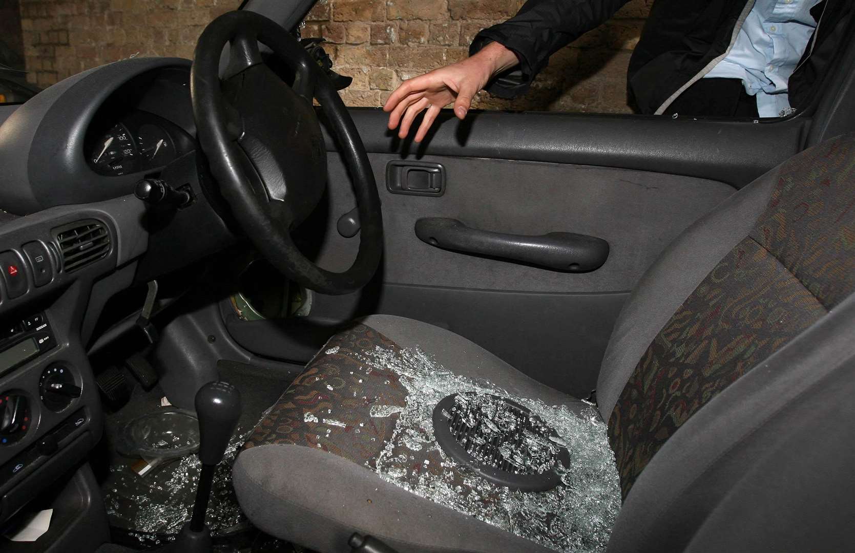 Three people have been arrested after a number of car thefts. Stock Image