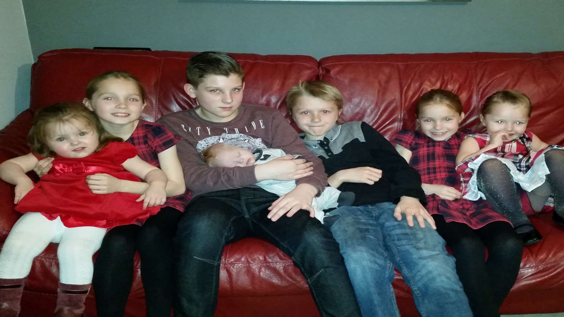 The Woodgate children: (left to right) Darcy, Amelia, Ethan, George, David, Madison and Isabella