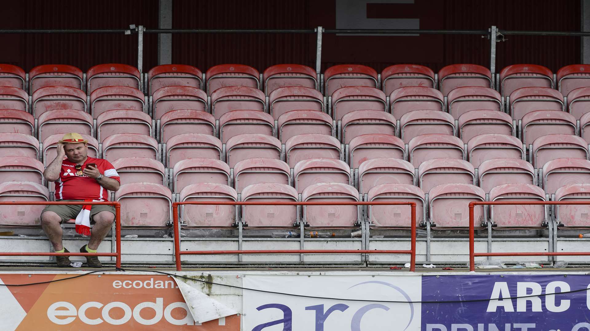 A sole Ebbsfleet fan sits in the stands, pondering what might have been. Picture: Andy Payton