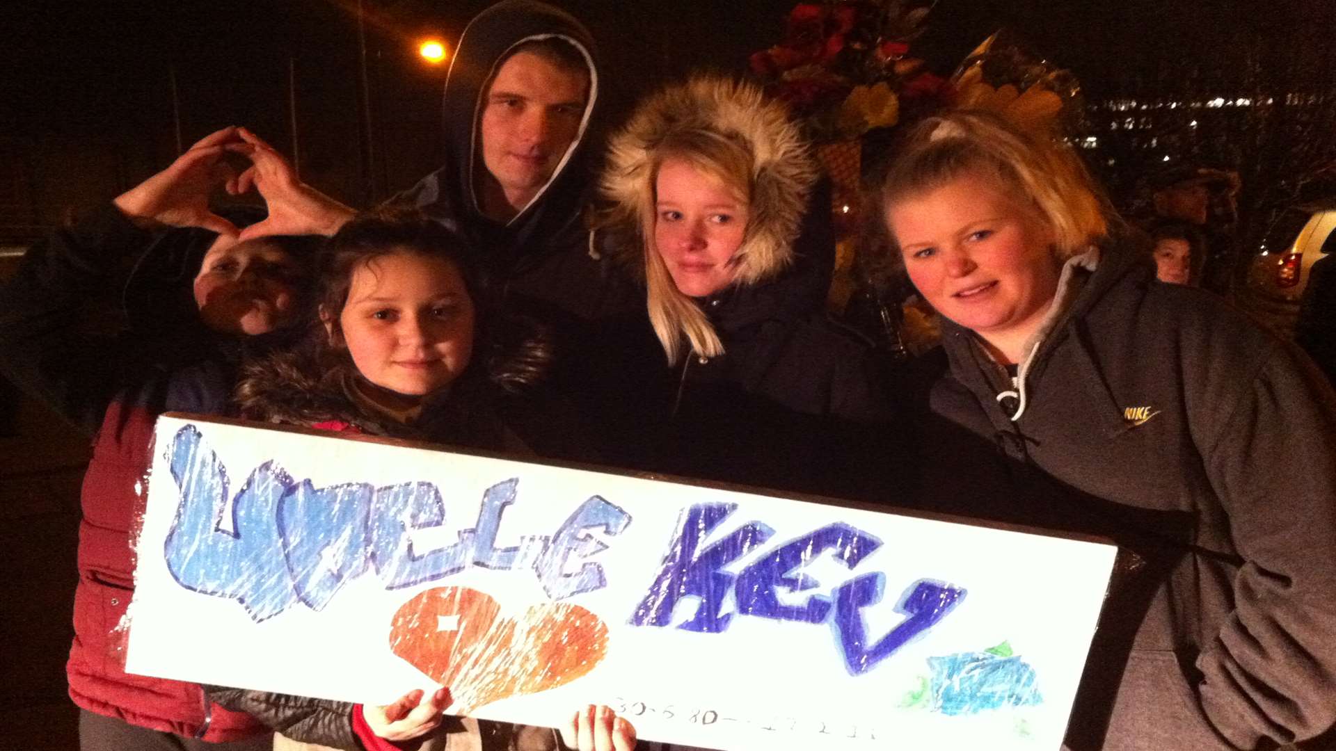 Kevin McKinley's nieces and nephews with a painted canvas they made.