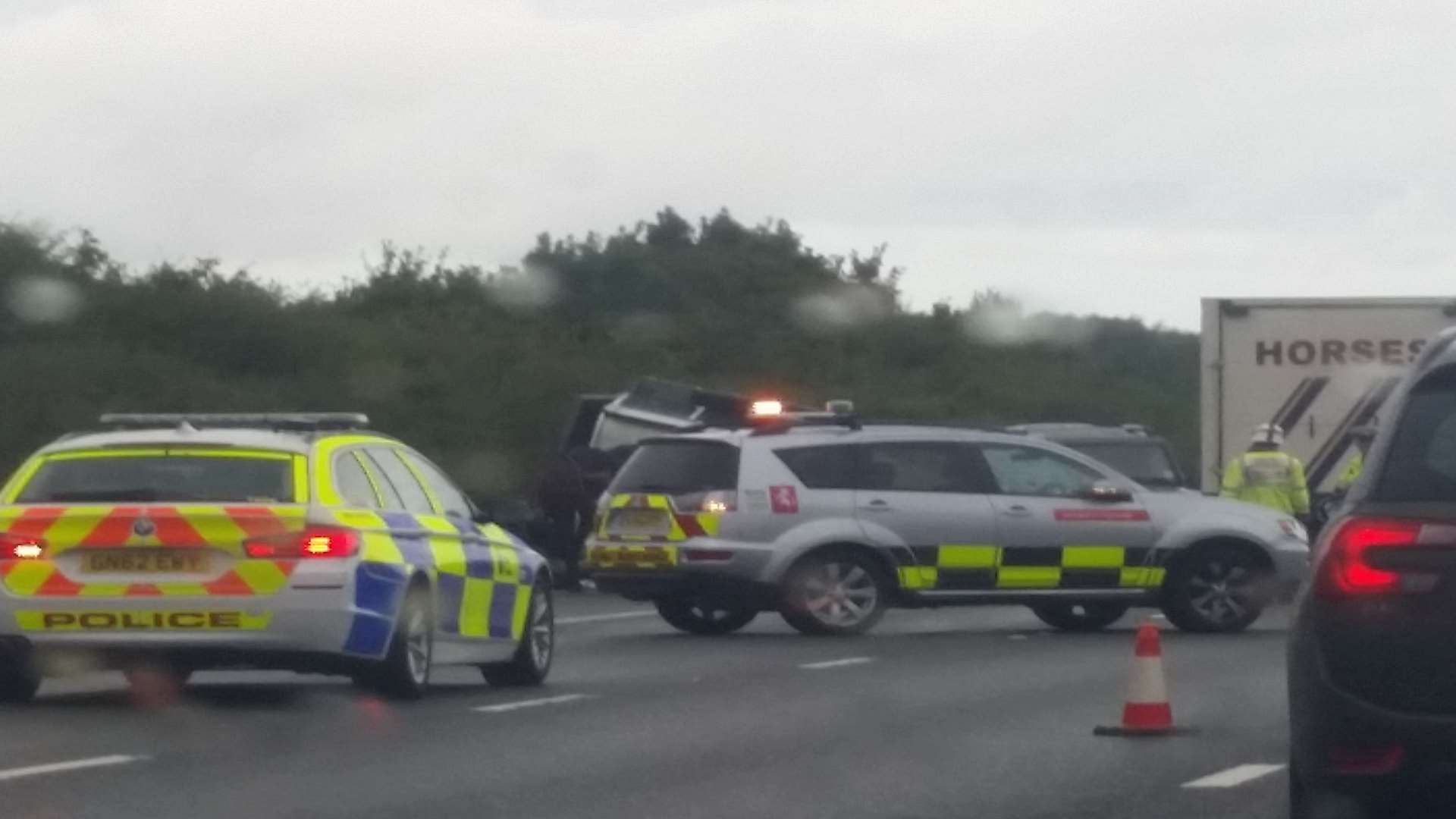 Emergency services at the scene of the accident on the M20 near Ashford this morning
