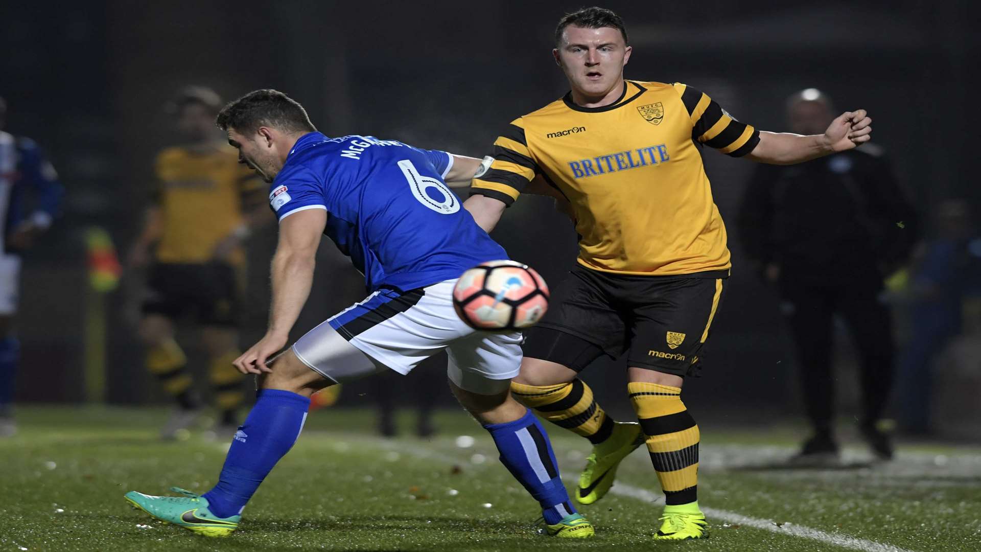 Maidstone's Alex Flisher takes on Rochdale's Harrison McGahey. Picture: Barry Goodwin