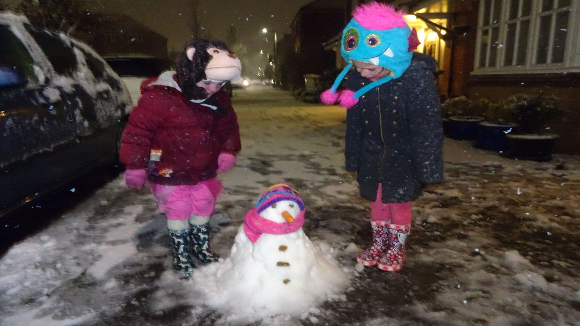 Lexie, 6, and Sophie, 3, enjoying their first experience of snow