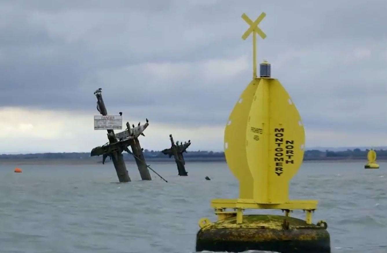 The masts of the Sheppey bomb ship the SS Richard Montgomery and danger buoy. Picture: NDR