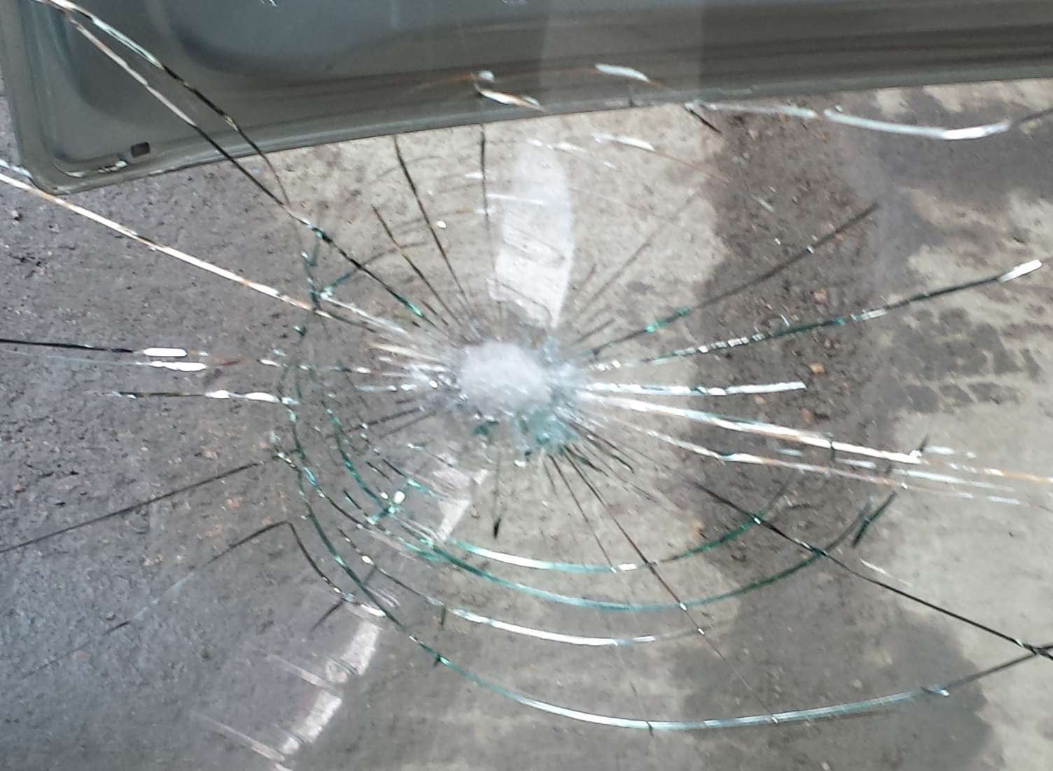 The smashed windscreen of the lorry