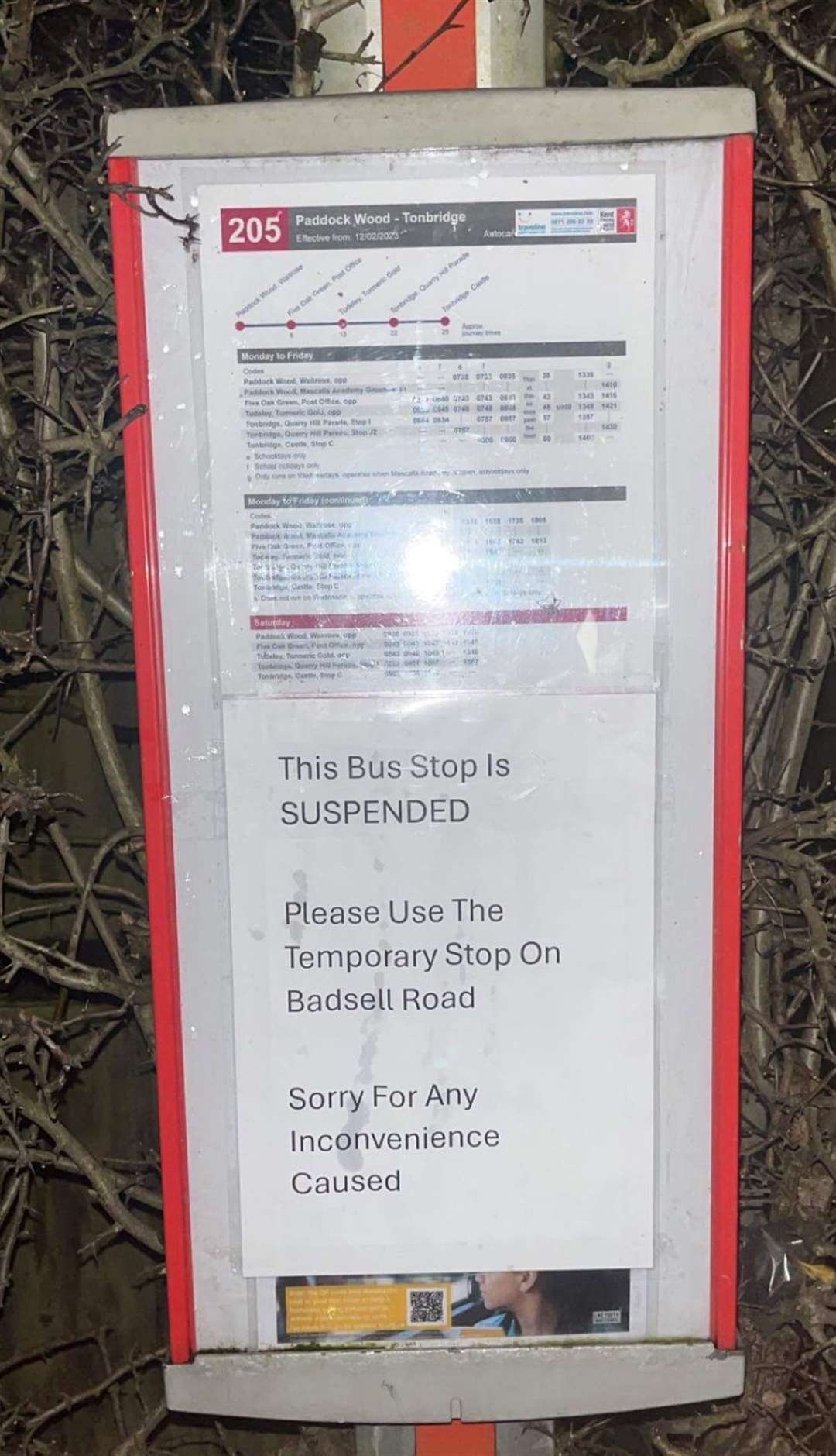 Scott covered the signs for the number 6 bus to let people know where the new stops are. Picture: Scott Miller