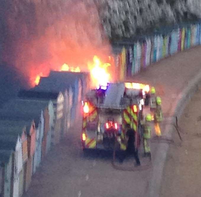 Firefighters tackle the blaze which destroyed seven huts. Picture: @TheBroadie