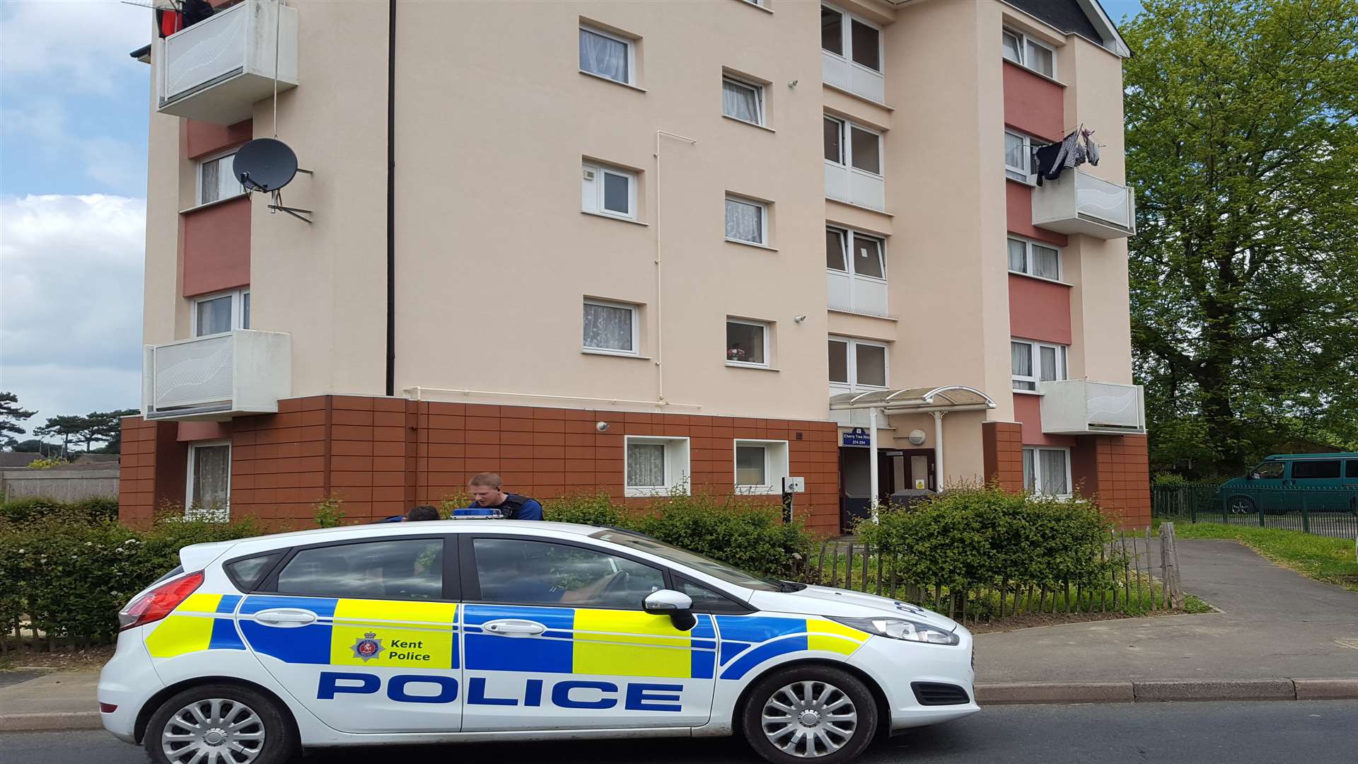Police at the flats following the death