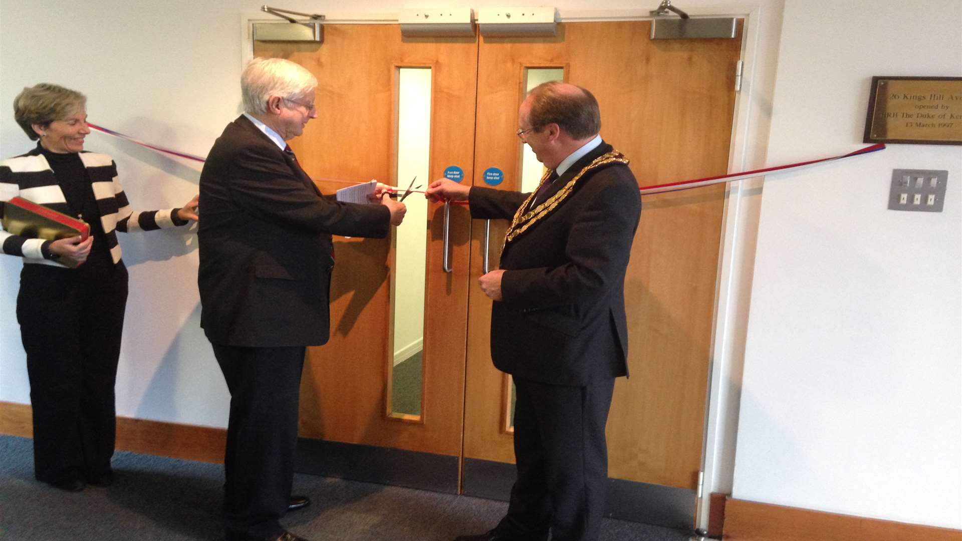 Group Captain Patrick Tootal and Mayor Howard Rogers cut the ribbon at Regus