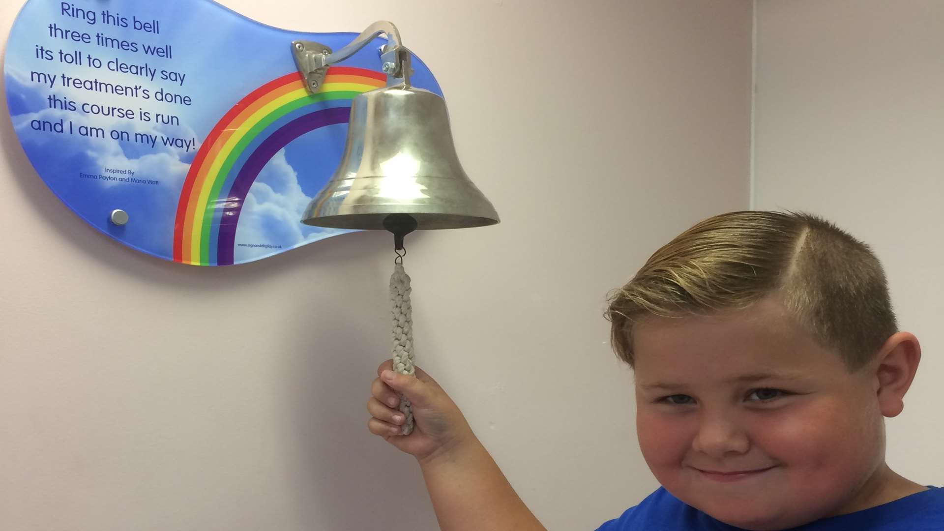 Aaron Lindridge, 8, ringing the End of Treatment bell after five years free of cancer
