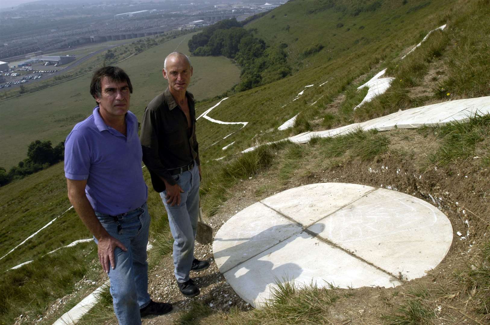 Artist Charles Newington and sculptor Brian Hall pictured in August 2003 just after installing the eye, which was the final part to be put in place