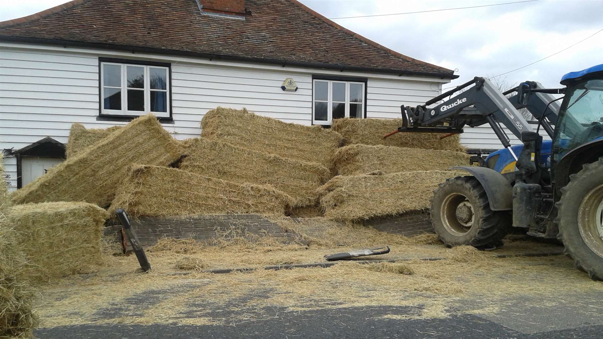 The wall was left damaged after the hay fell from the lorry